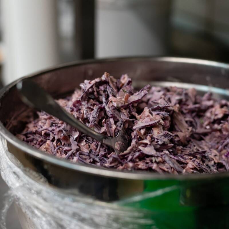 Homemade creamy coleslaw with shredded cabbage and carrots in a serving bowl