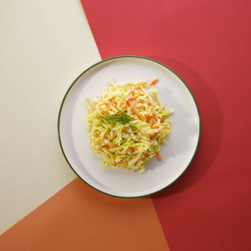 Fresh creamy coleslaw with shredded cabbage ready to serve