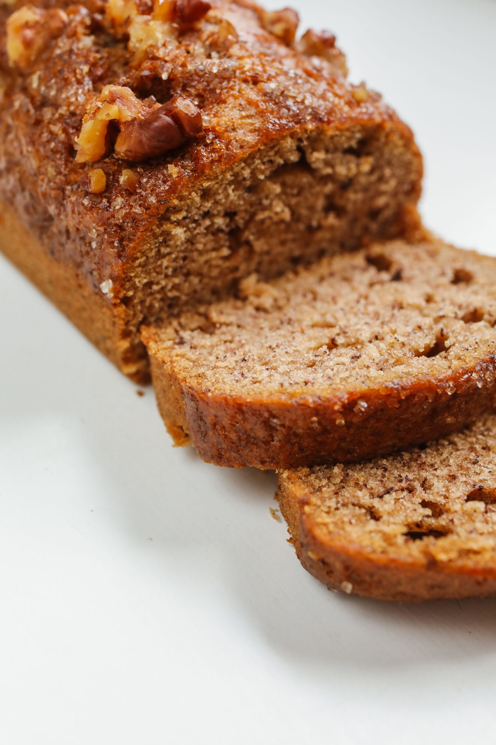 Close-up slice of easy banana bread recipe loaf showing a moist, tender crumb